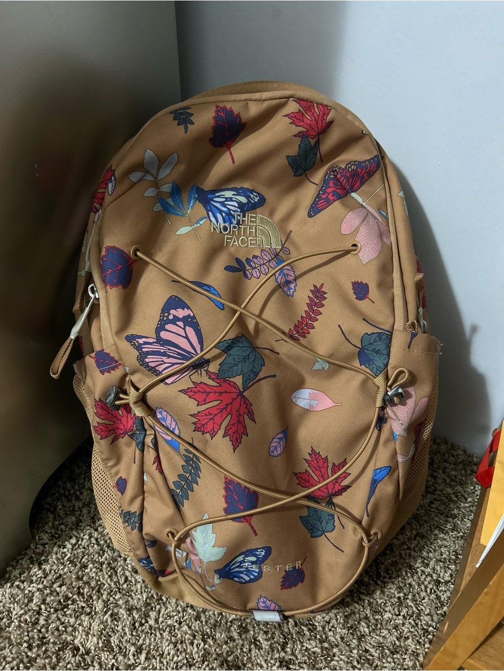 The North Face Tan Backpack with Multicolor Butterfly & Leaf Print